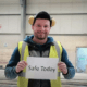 Construction Safety Week 2022 sign held by a worker
